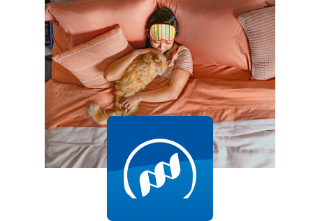 A dog eating from a bowl indoors